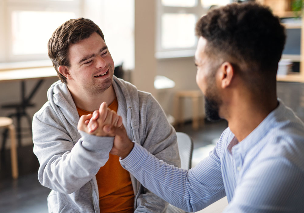 Carer and patient shaking hands